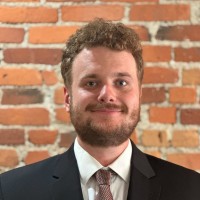 September 2025 Man smiling at camera wearing suit and tie